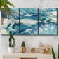 Three-panel canvas wall art featuring layered abstract marble textures, displayed in a boho-chic entryway above a console table.