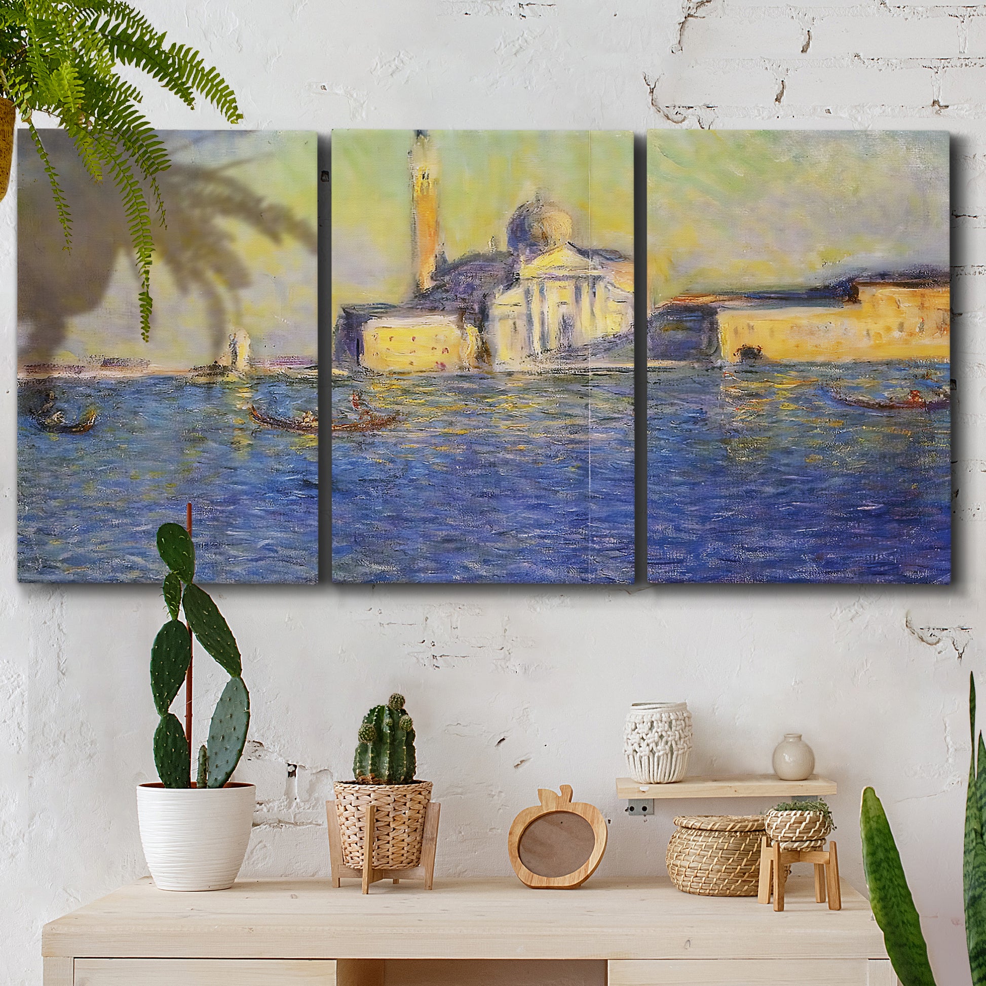 Three-panel canvas wall art featuring layered modern abstract color ribbons, displayed in a boho-chic entryway above a console table.