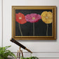 Contemporary poppy flower artwork in an ornate traditional gold frame displayed in a light-toned interior setting.