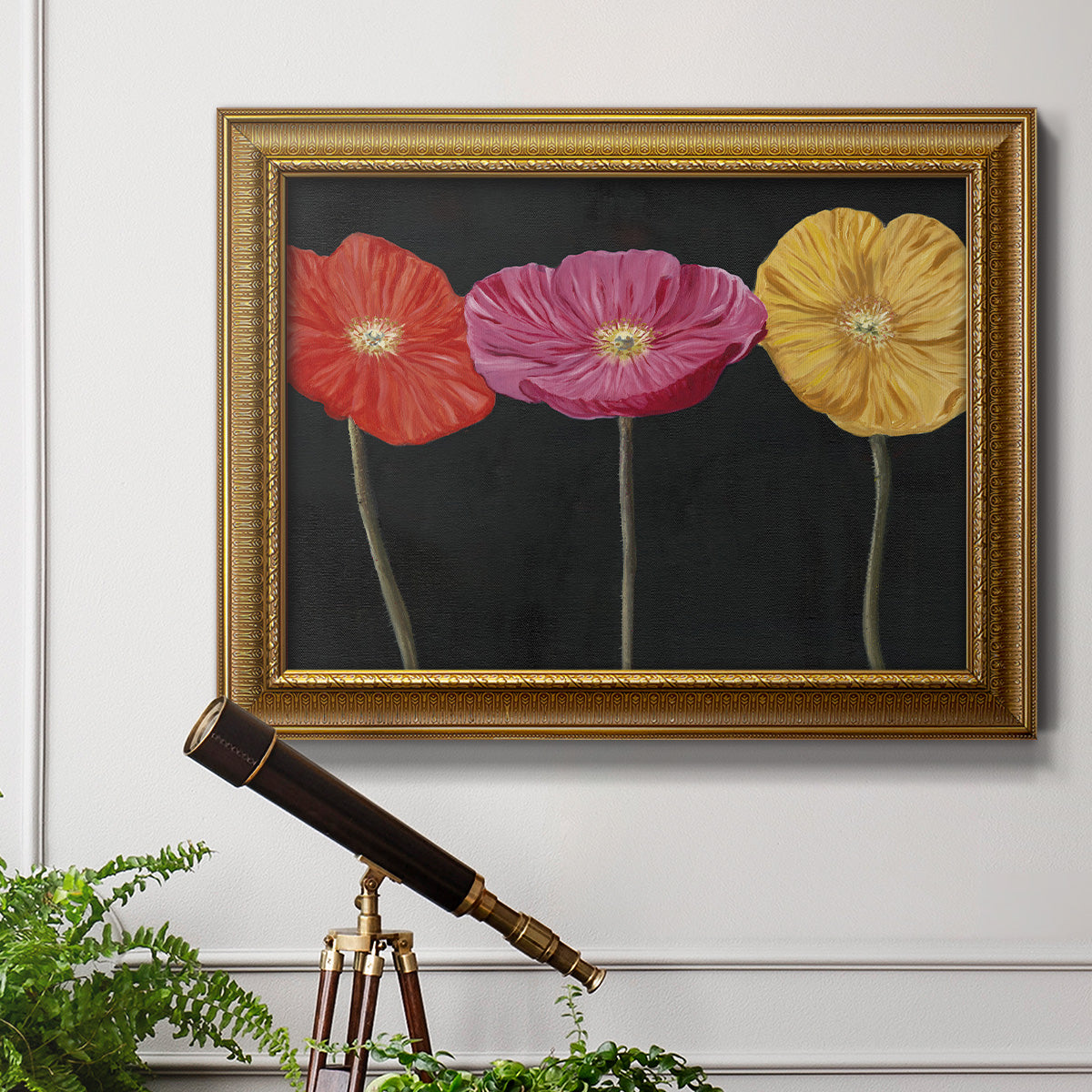 Contemporary poppy flower artwork in an ornate traditional gold frame displayed in a light-toned interior setting.