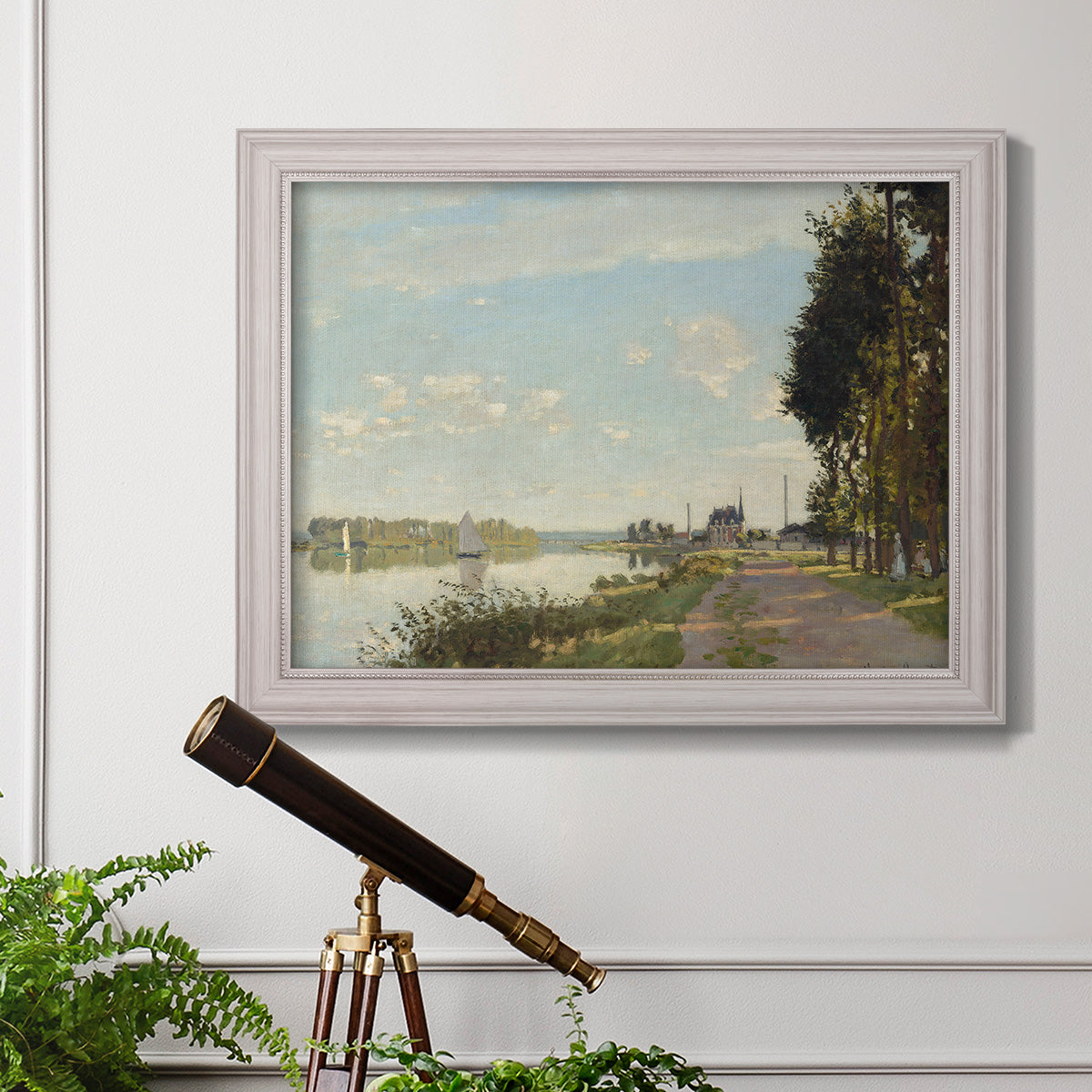 Impressionist river scene with red boats by Claude Monet in an ornate weathered white frame displayed in a light-toned interior setting.