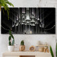 Three-panel canvas wall art featuring vintage city scene with figures, displayed in a boho-chic entryway above a console table.