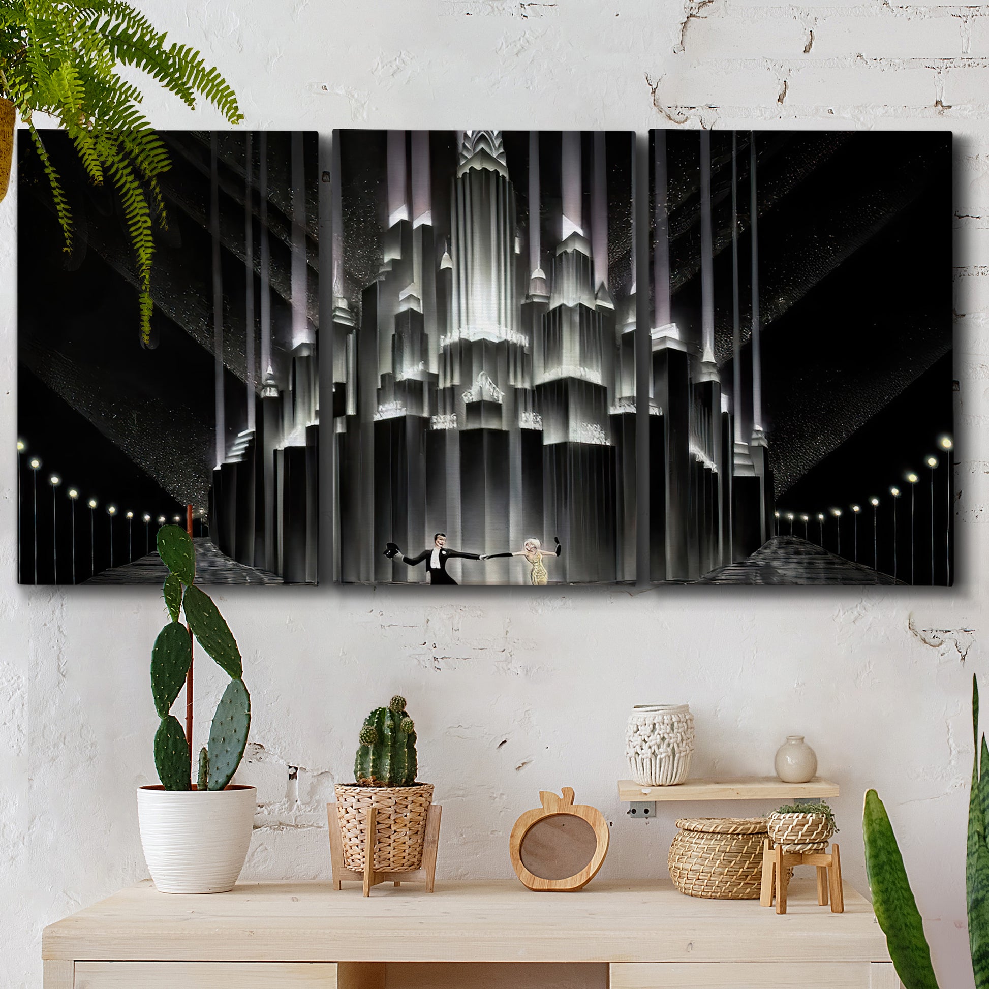 Three-panel canvas wall art featuring vintage city scene with figures, displayed in a boho-chic entryway above a console table.