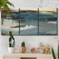 Three-panel canvas wall art featuring rocky coastal bluff above sea, displayed in a boho-chic entryway above a console table.