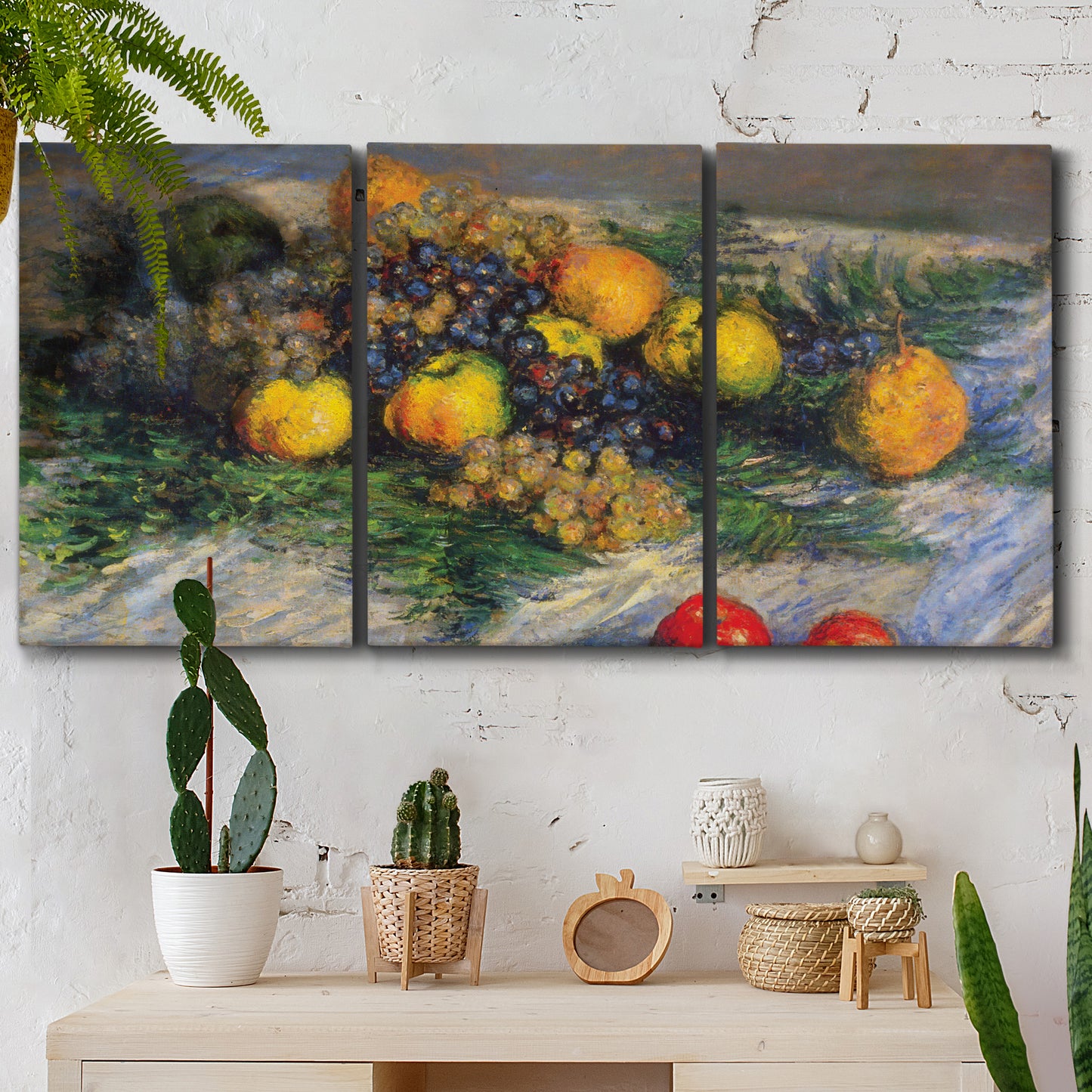 Three-panel canvas wall art featuring still life with pears and grapes, displayed in a boho-chic entryway above a console table.