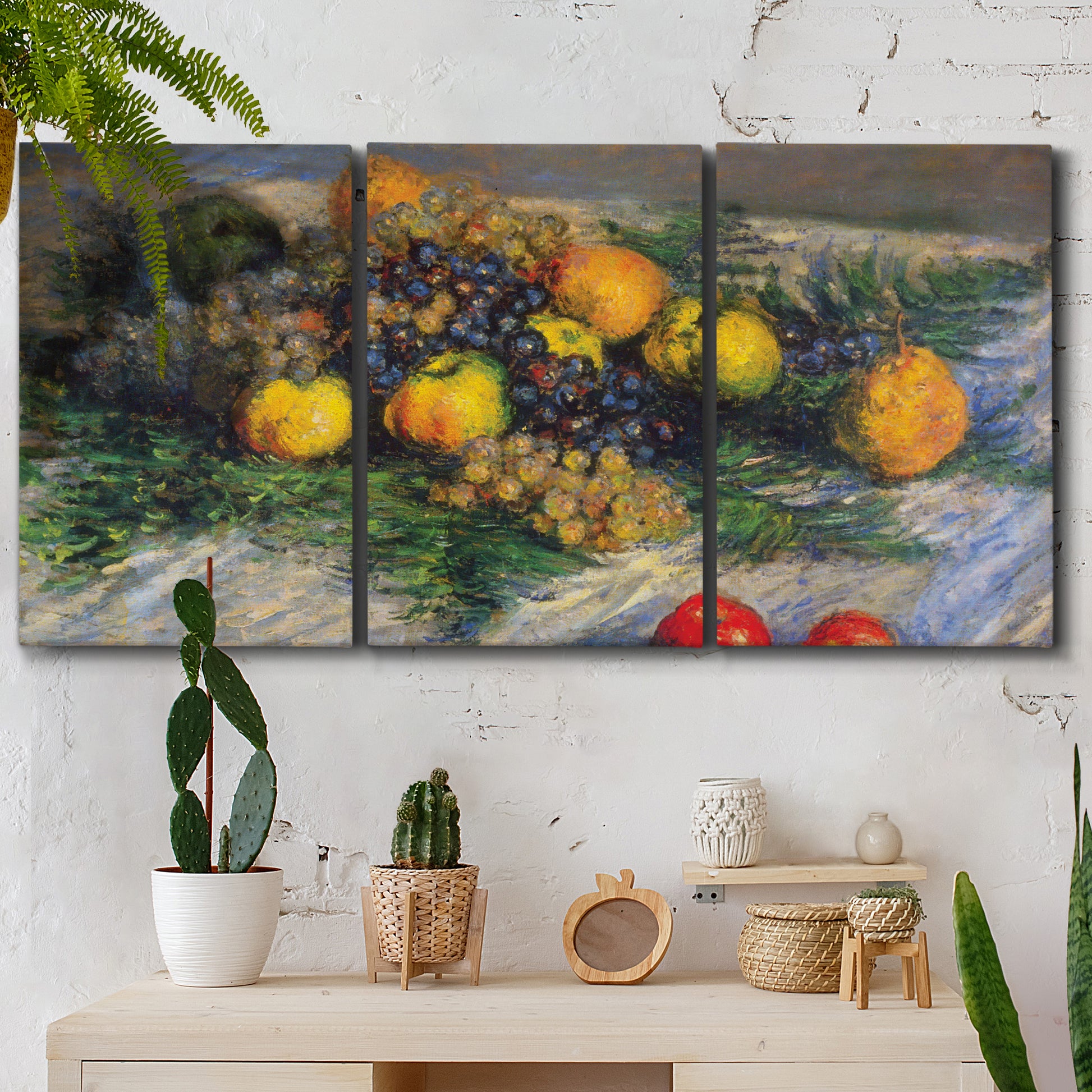 Three-panel canvas wall art featuring still life with pears and grapes, displayed in a boho-chic entryway above a console table.