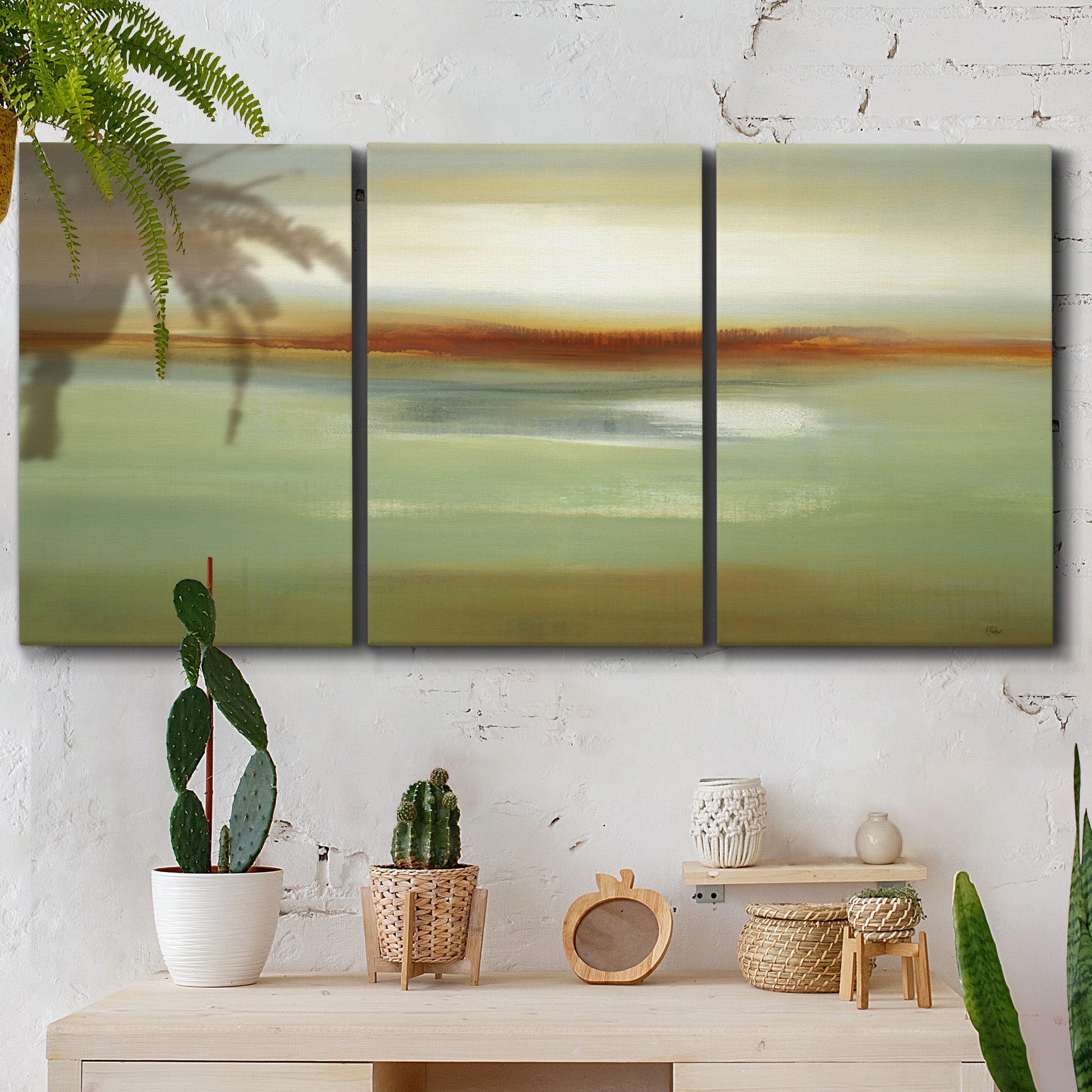 Three-panel canvas wall art featuring green focused abstract color vision, displayed in a boho-chic entryway above a console table.