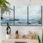 Three-panel canvas wall art featuring abstract sailboats on water, displayed in a boho-chic entryway above a console table.