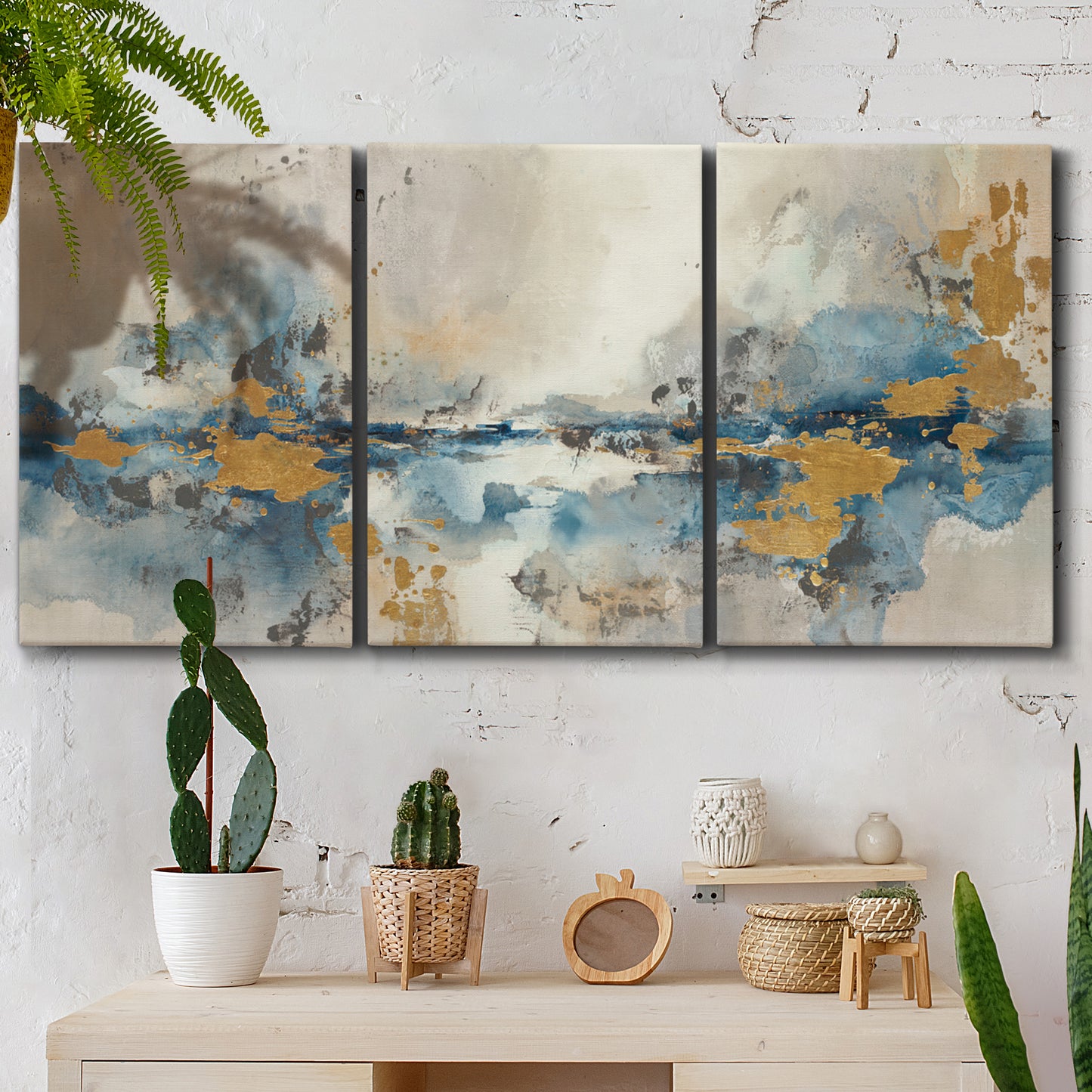 Three-panel canvas wall art featuring abstract soft morning light, displayed in a boho-chic entryway above a console table.