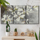 Three-panel canvas wall art featuring delicate floral symbolic arrangement, displayed in a boho-chic entryway above a console table.