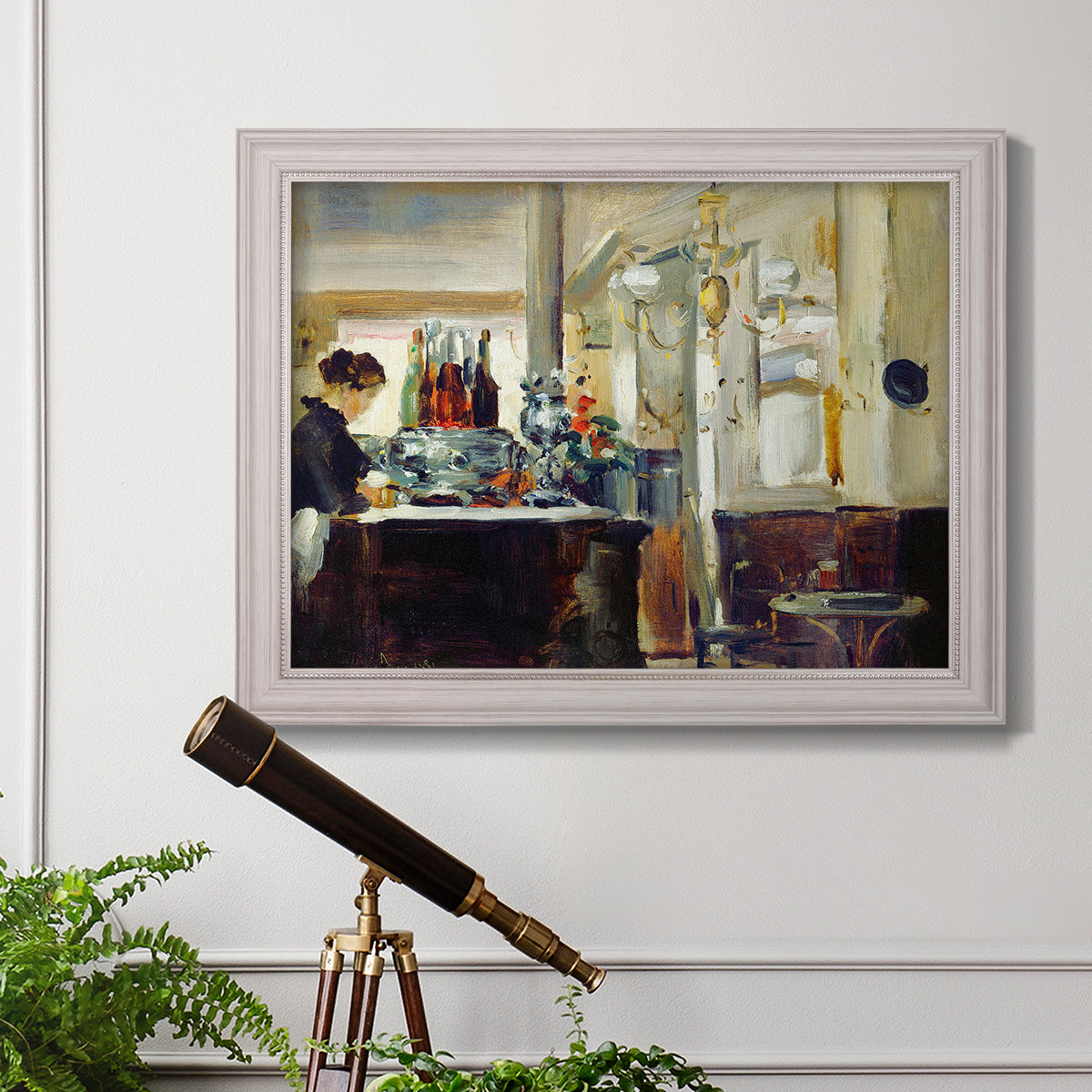 Impressionist café still life scene by Édouard Manet in an ornate weathered white frame displayed in a light-toned interior setting.