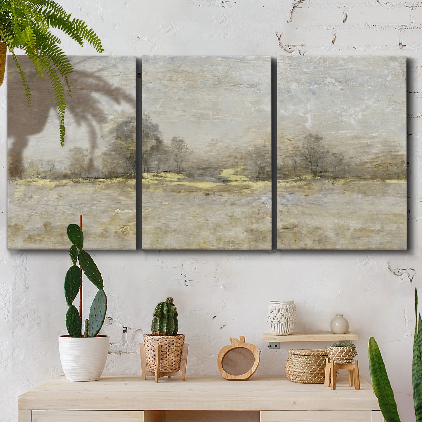 Three-panel canvas wall art featuring late season rural harvest fields, displayed in a boho-chic entryway above a console table.