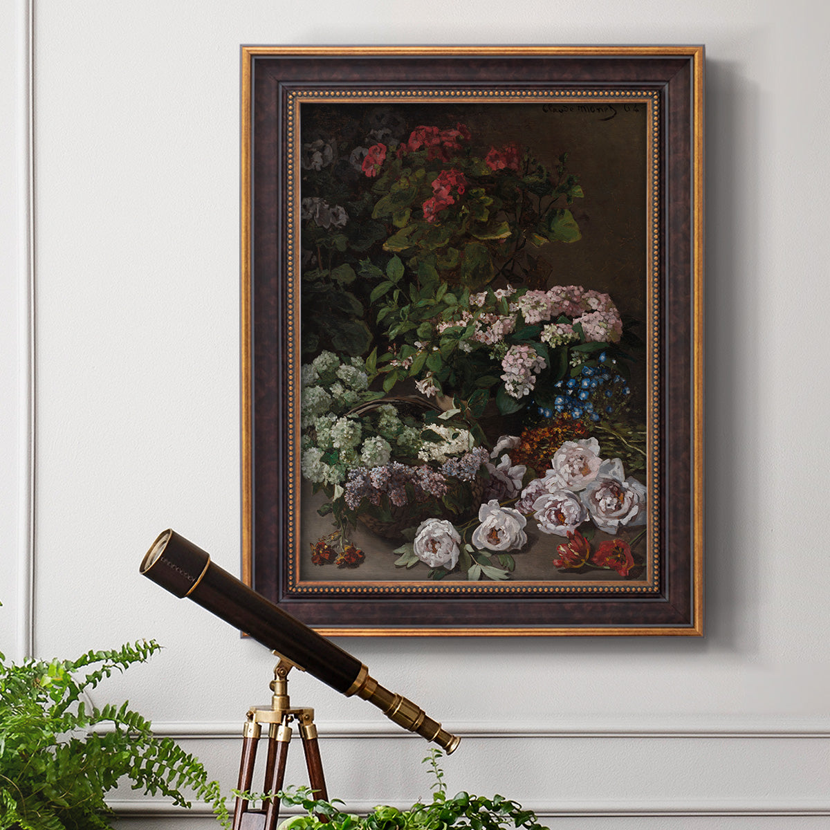 Early impressionist floral painting by Claude Monet in an ornate bronzed mahogany wood frame displayed in a light-toned interior setting.