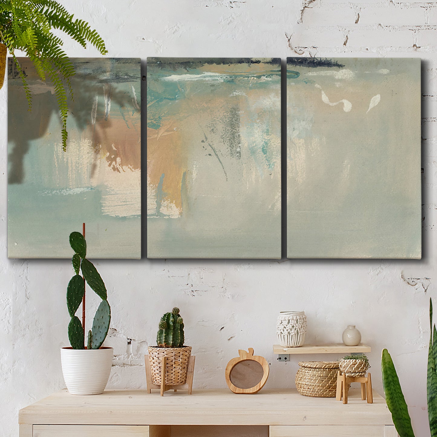 Three-panel canvas wall art featuring minimalist abstract emotional fields, displayed in a boho-chic entryway above a console table.