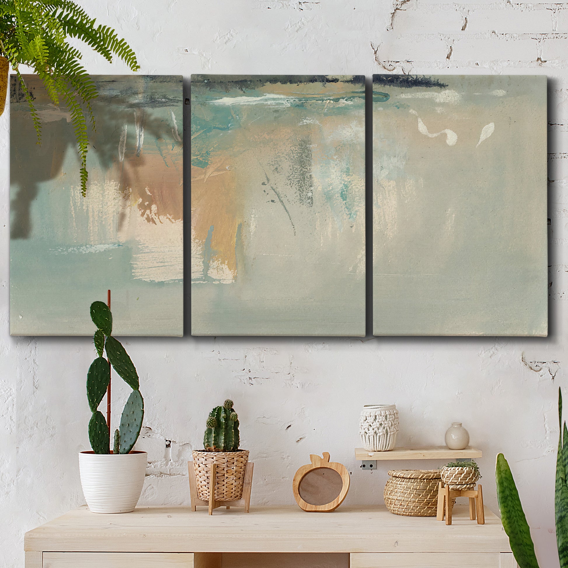 Three-panel canvas wall art featuring minimalist abstract emotional fields, displayed in a boho-chic entryway above a console table.