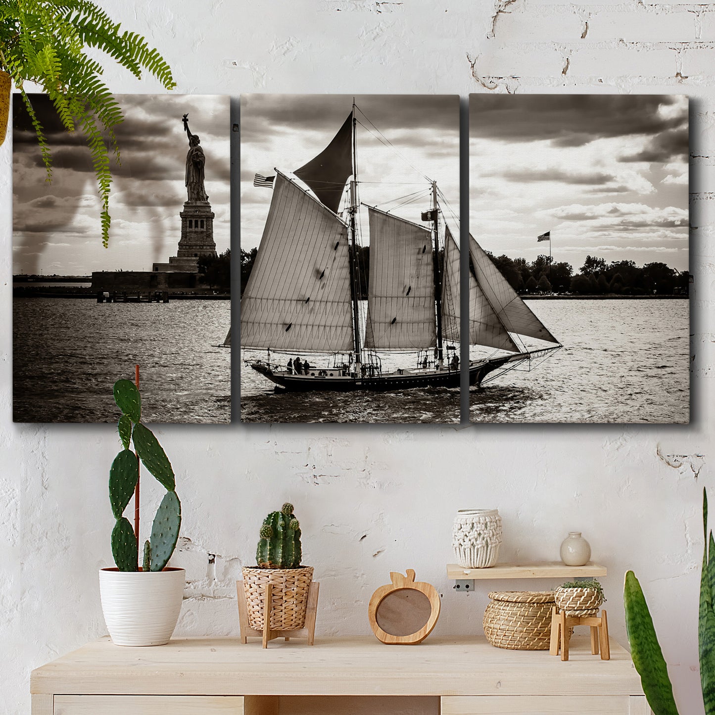 Three-panel canvas wall art featuring historic sailing ships photograph, displayed in a boho-chic entryway above a console table.