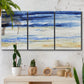 Three-panel canvas wall art featuring turbulent abstract ocean wave motion, displayed in a boho-chic entryway above a console table.