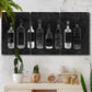 Three-panel canvas wall art featuring illustrated wine bottle cellar diagram, displayed in a boho-chic entryway above a console table.