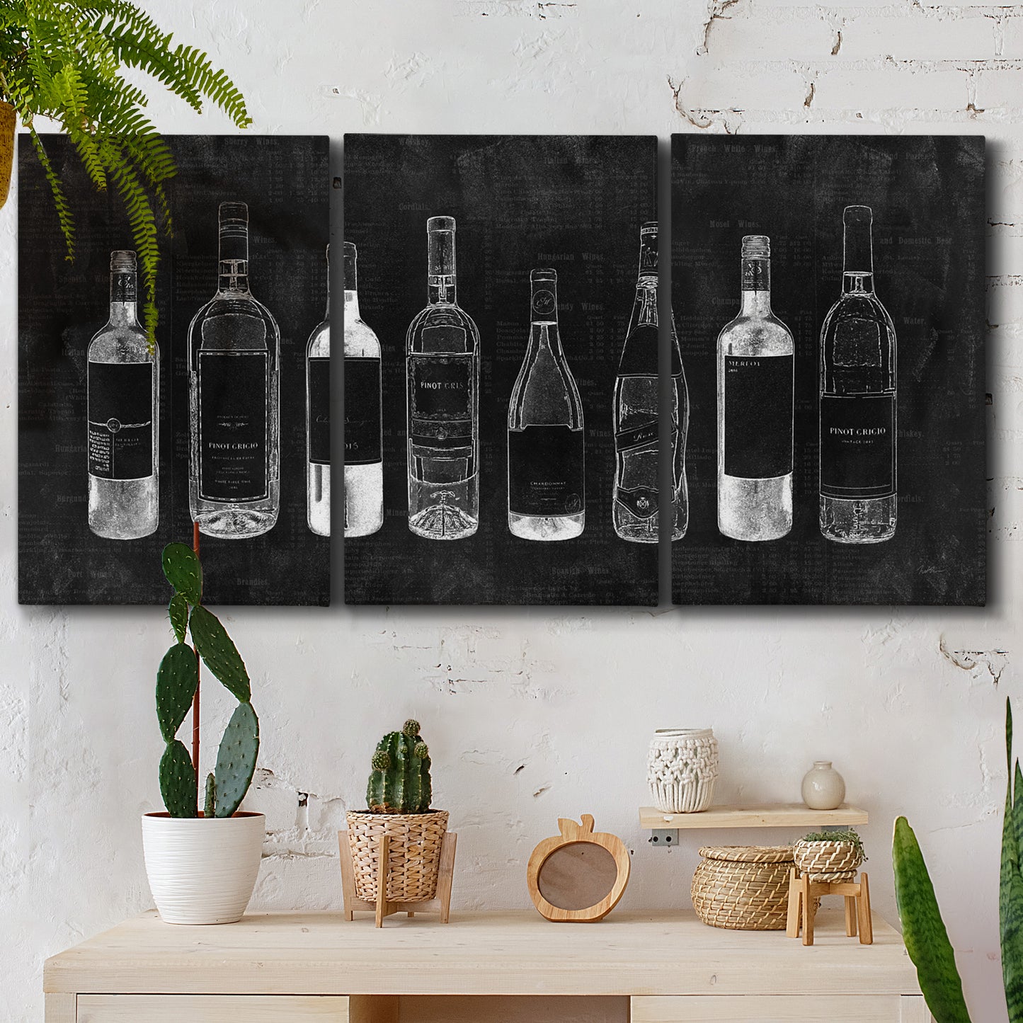 Three-panel canvas wall art featuring illustrated wine bottle cellar diagram, displayed in a boho-chic entryway above a console table.
