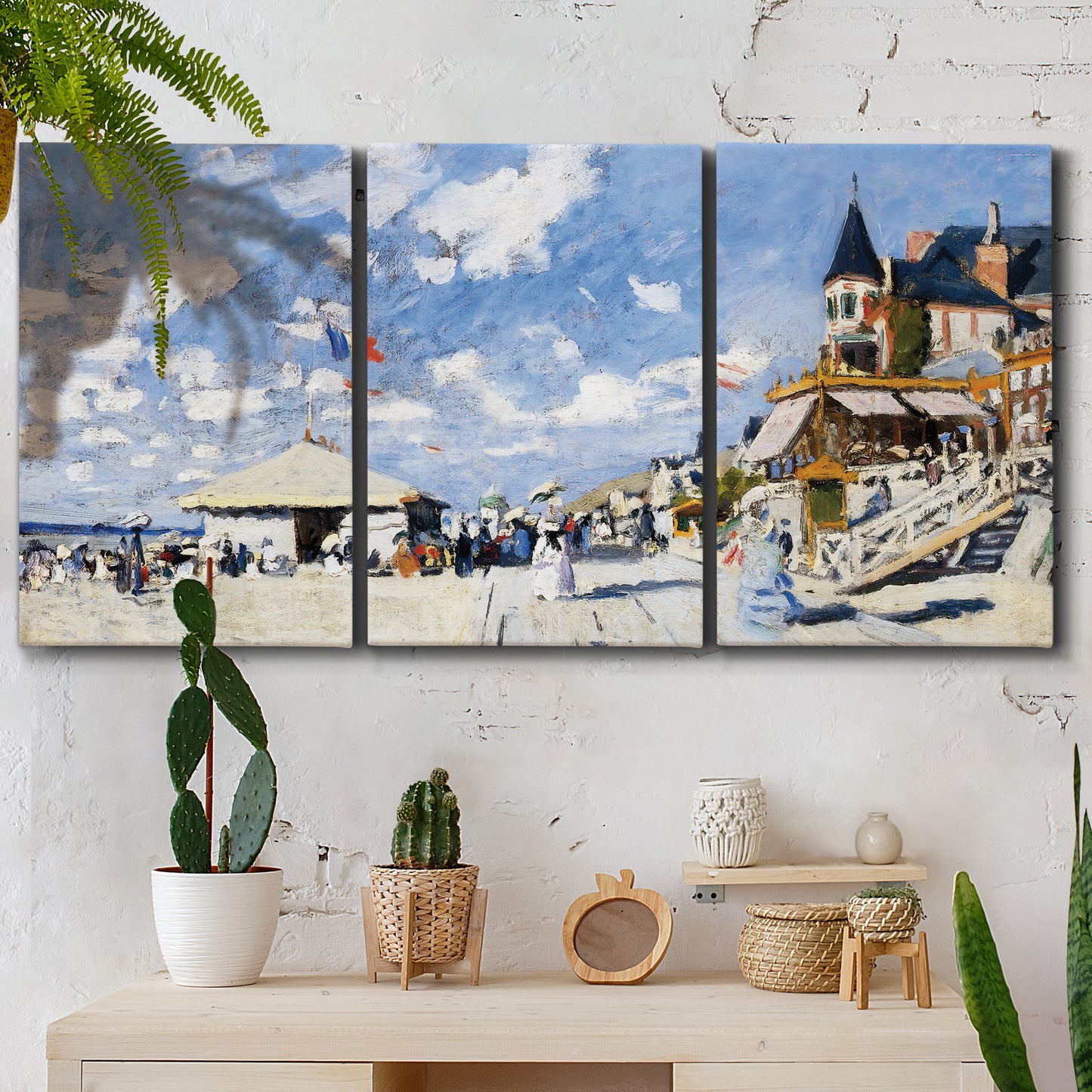 Three-panel canvas wall art featuring beach boardwalk with figures, displayed in a boho-chic entryway above a console table.