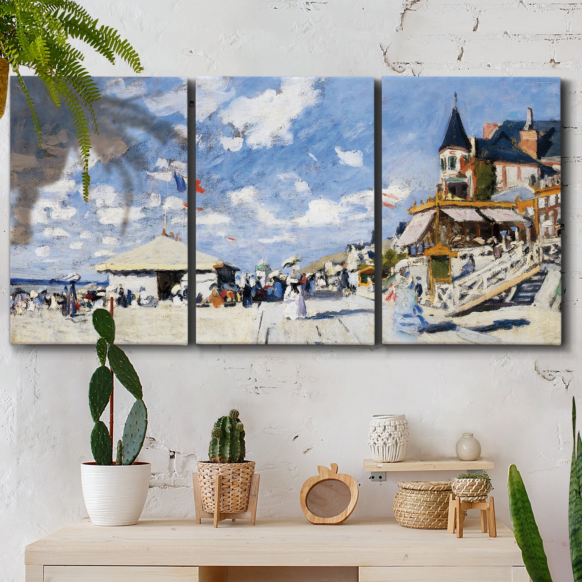 Three-panel canvas wall art featuring beach boardwalk with figures, displayed in a boho-chic entryway above a console table.