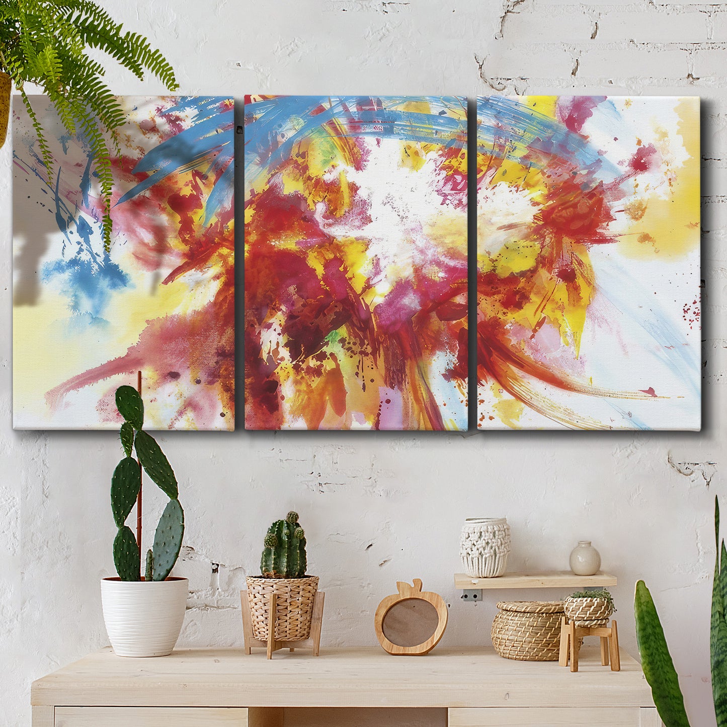 Three-panel canvas wall art featuring bright abstract summer palette, displayed in a boho-chic entryway above a console table.