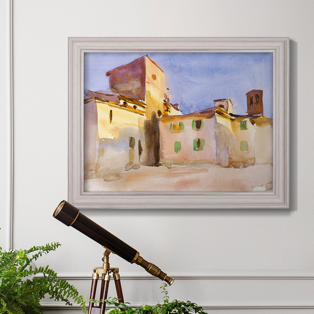 Impressionist Italian village scene by John Singer Sargent in an ornate weathered white frame displayed in a light-toned interior setting.