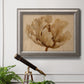 Minimalist sepia tulip botanical artwork in an ornate vintage silver frame displayed in a light-toned interior setting.