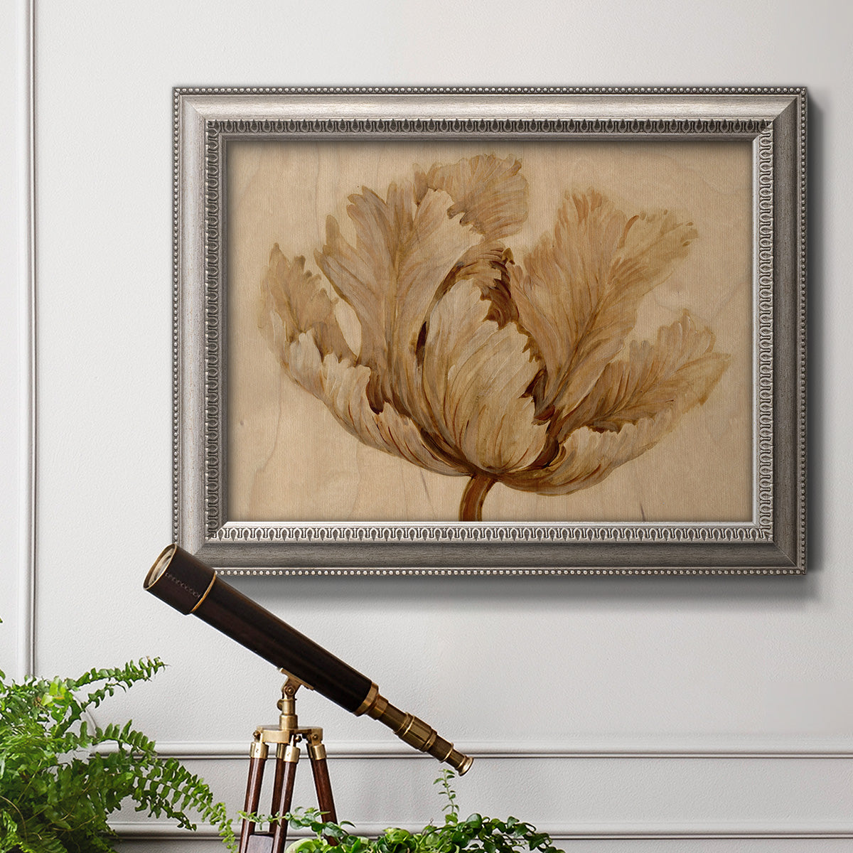 Minimalist sepia tulip botanical artwork in an ornate vintage silver frame displayed in a light-toned interior setting.