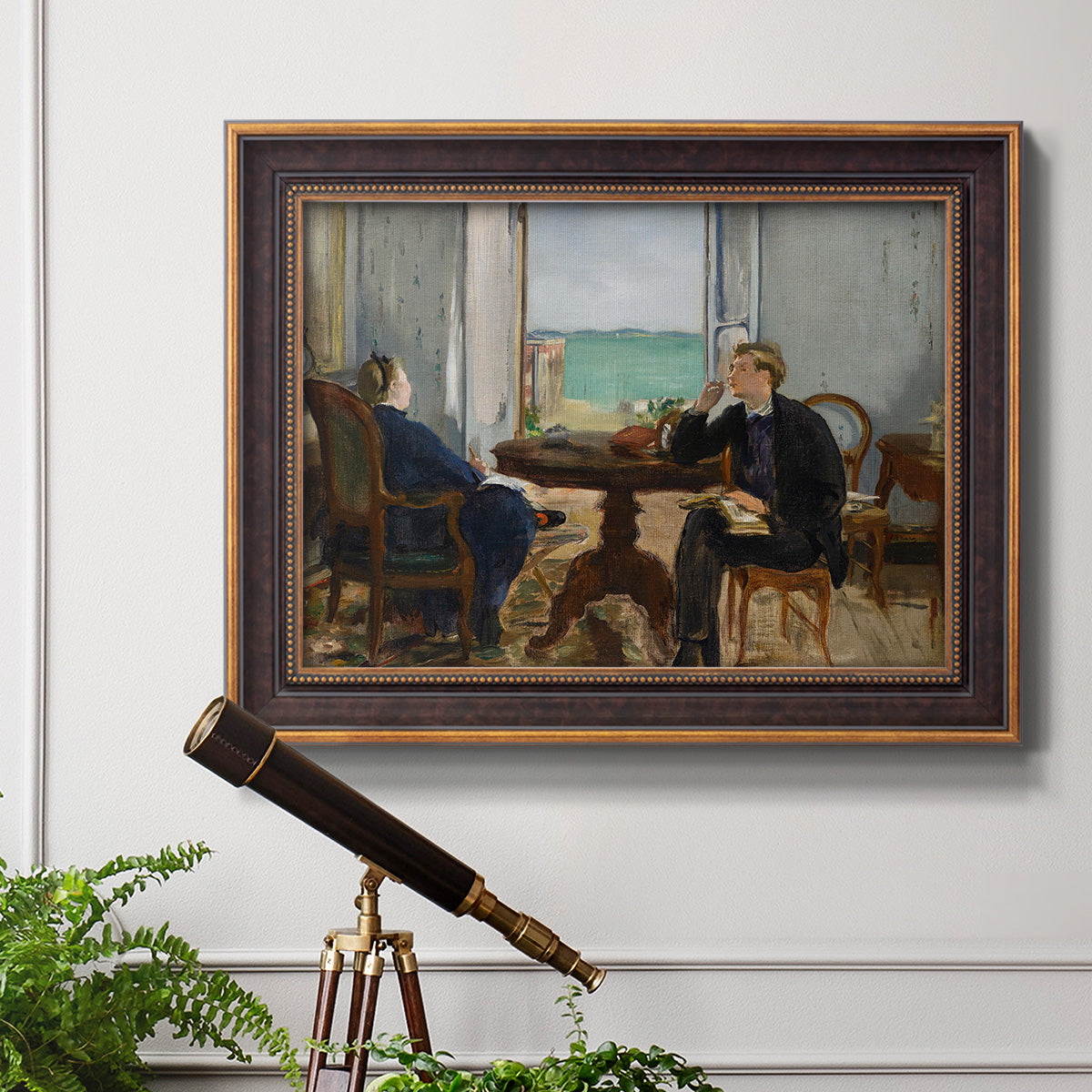 Impressionist interior scene by Édouard Manet in an ornate bronzed mahogany wood frame displayed in a light-toned interior setting.