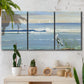 Three-panel canvas wall art featuring sunrise reflecting across bay waters, displayed in a boho-chic entryway above a console table.
