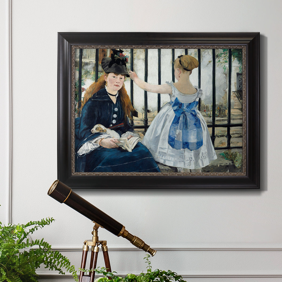 Impressionist urban scene near a railway by Édouard Manet in an ornate black frame with gilded inner detail displayed in a light-toned interior setting.