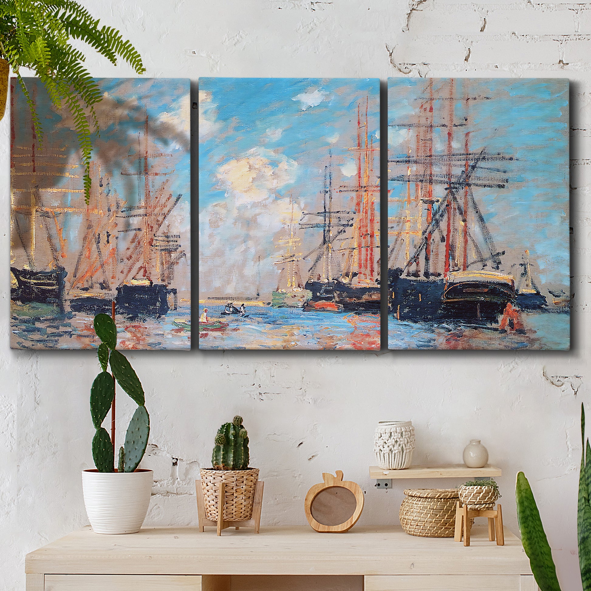 Three-panel canvas wall art featuring harbor with boats and water, displayed in a boho-chic entryway above a console table.