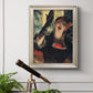 Impressionist portrait of a café singer by Edgar Degas in an ornate champagne frame displayed in a light-toned interior setting.
