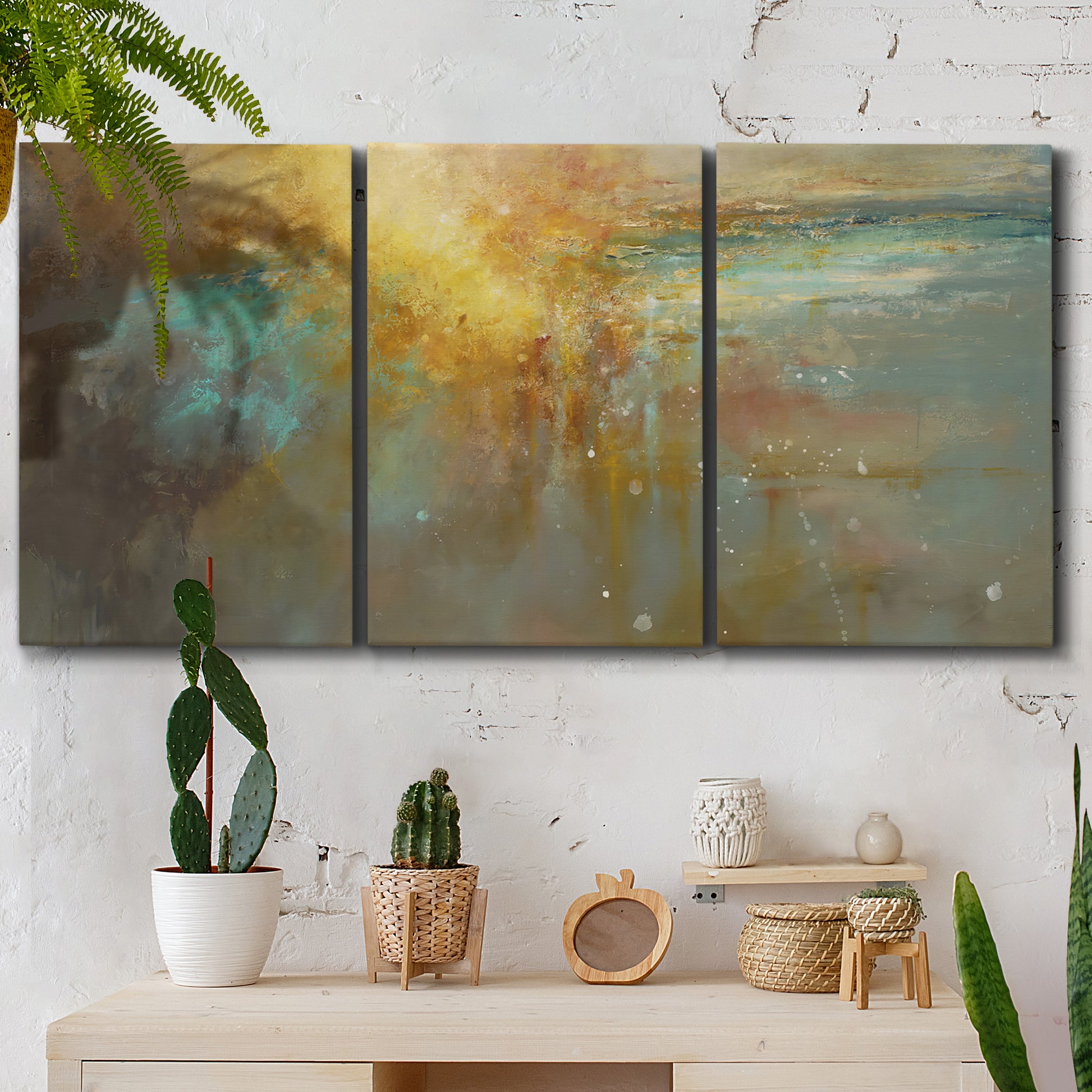 Three-panel canvas wall art featuring muted abstract river inspired tones, displayed in a boho-chic entryway above a console table.