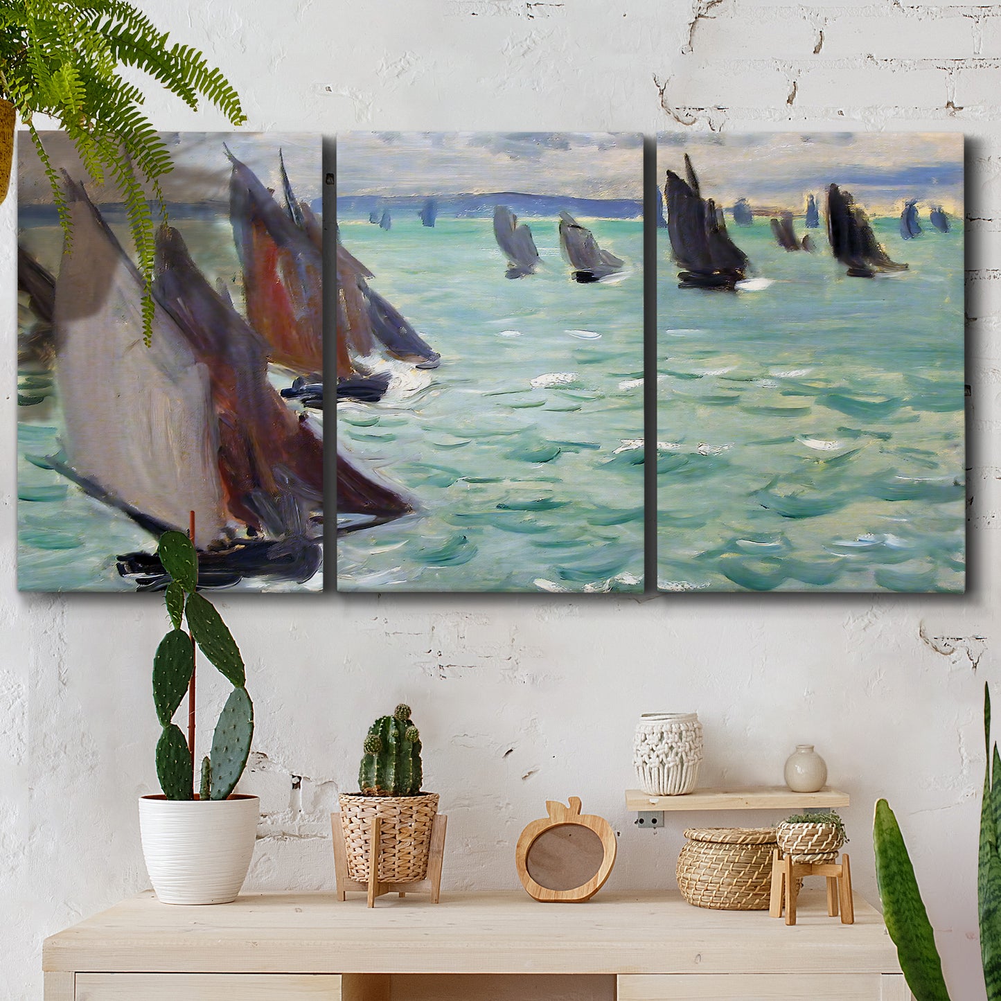 Three-panel canvas wall art featuring sailboat regatta near coastal village, displayed in a boho-chic entryway above a console table.