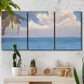 Three-panel canvas wall art featuring coastal shoreline with distant horizon, displayed in a boho-chic entryway above a console table.