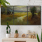 Three-panel canvas wall art featuring winding rural road through countryside, displayed in a boho-chic entryway above a console table.
