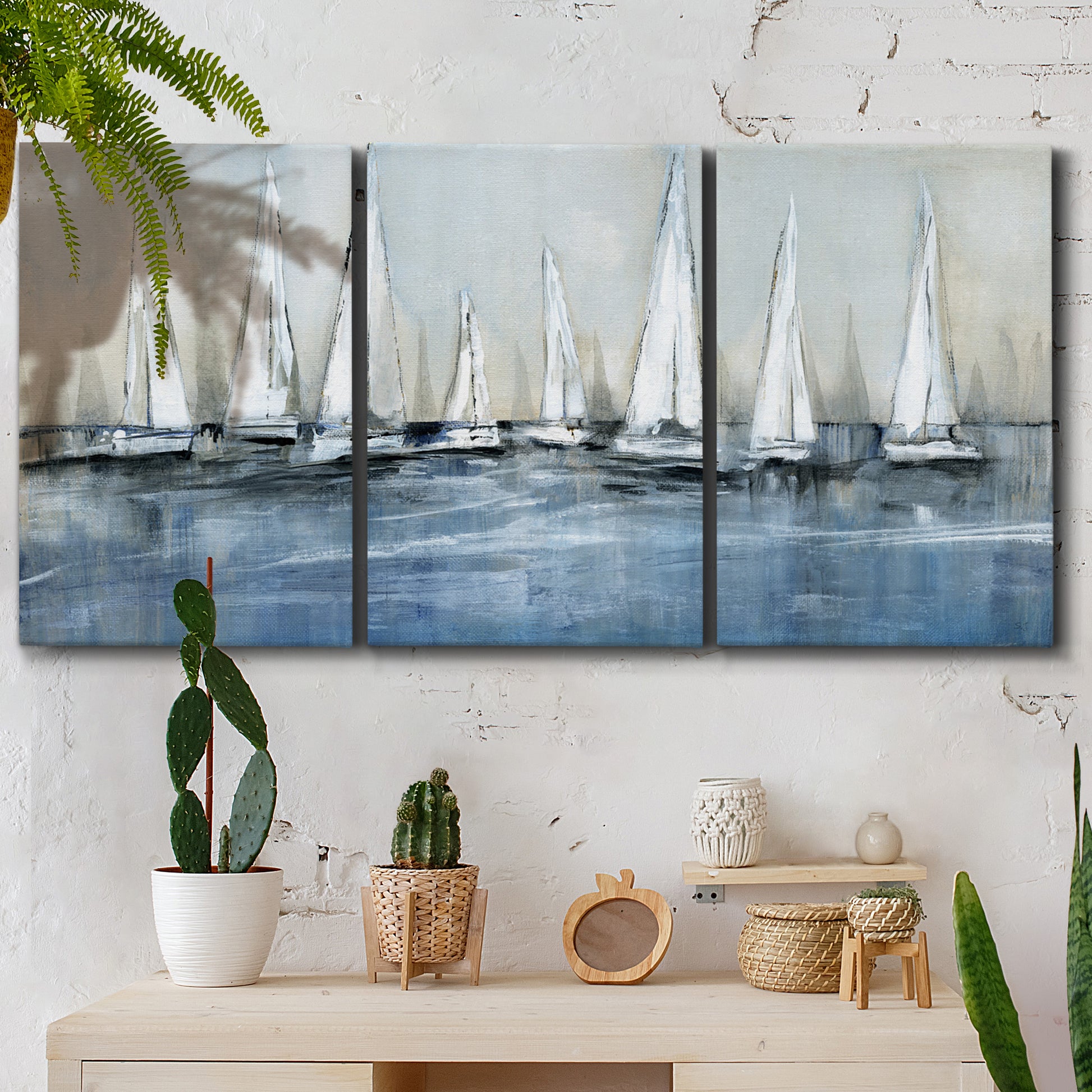 Three-panel canvas wall art featuring still life with pears and grapes, displayed in a boho-chic entryway above a console table.
