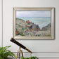 Impressionist coastal watch cabin scene by Claude Monet in an ornate champagne frame displayed in a light-toned interior setting.