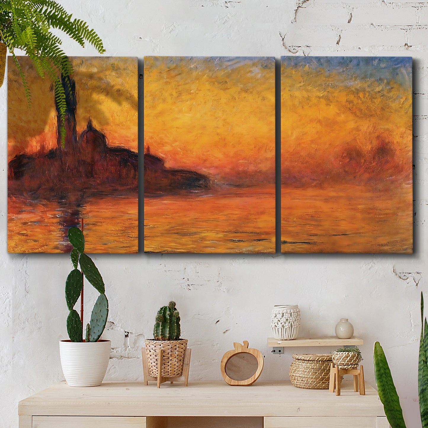 Three-panel canvas wall art featuring Venetian church at sunset, displayed in a boho-chic entryway above a console table.