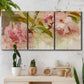 Three-panel canvas wall art featuring soft floral blossom composition, displayed in a boho-chic entryway above a console table.