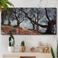 Three-panel canvas wall art featuring pine trees silhouetted at evening, displayed in a boho-chic entryway above a console table.