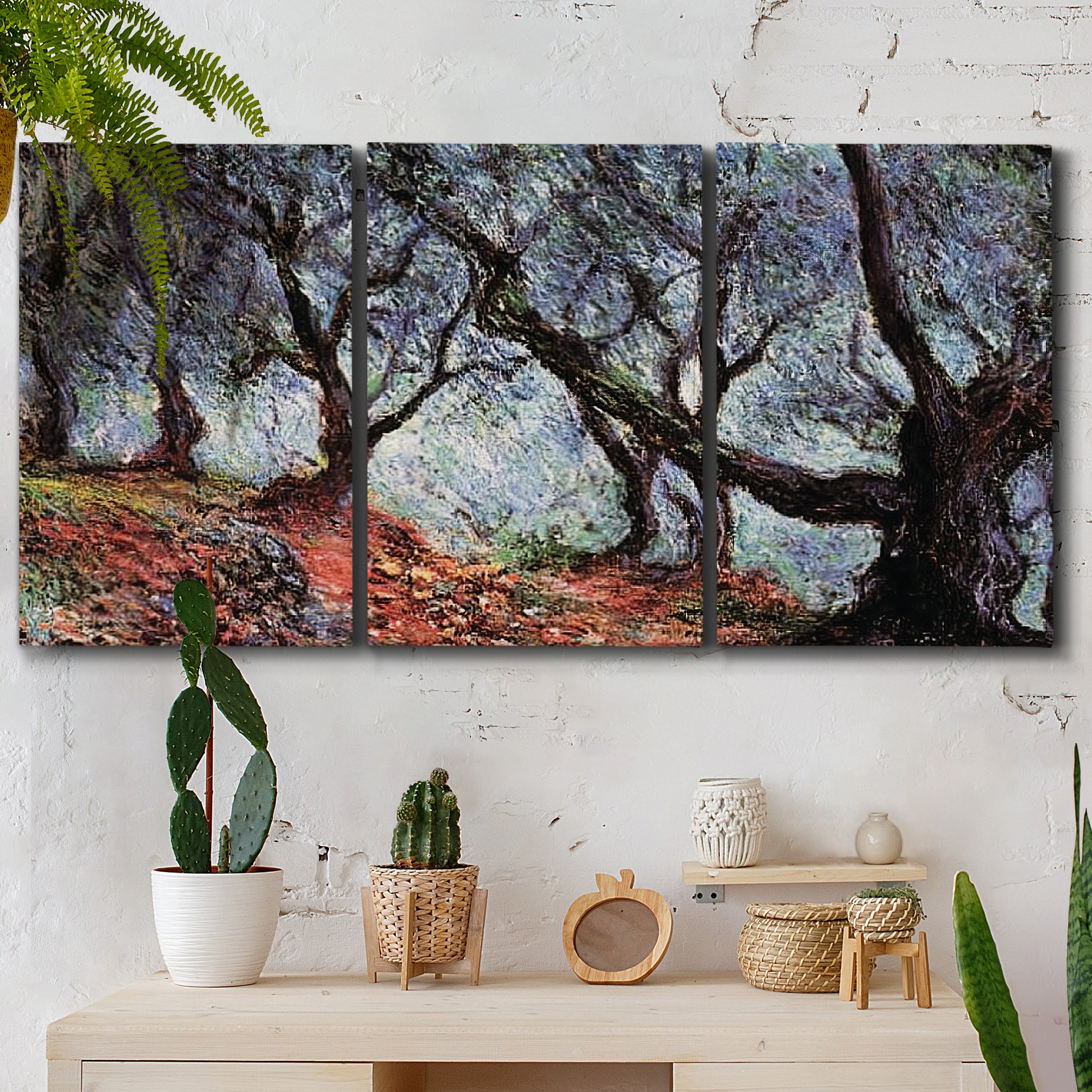 Three-panel canvas wall art featuring pine trees silhouetted at evening, displayed in a boho-chic entryway above a console table.