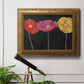 Contemporary poppy flower artwork in an ornate vintage gold frame displayed in a light-toned interior setting.