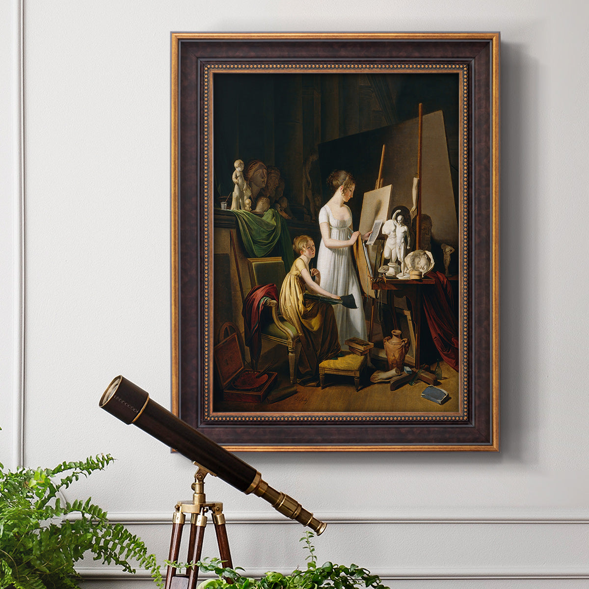 Classical interior painting of an artist at work by Louis-Leopold Boilly in an ornate bronzed mahogany wood frame displayed in a light-toned interior setting.