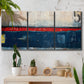 Three-panel canvas wall art featuring weathered coastal dock scene, displayed in a boho-chic entryway above a console table.