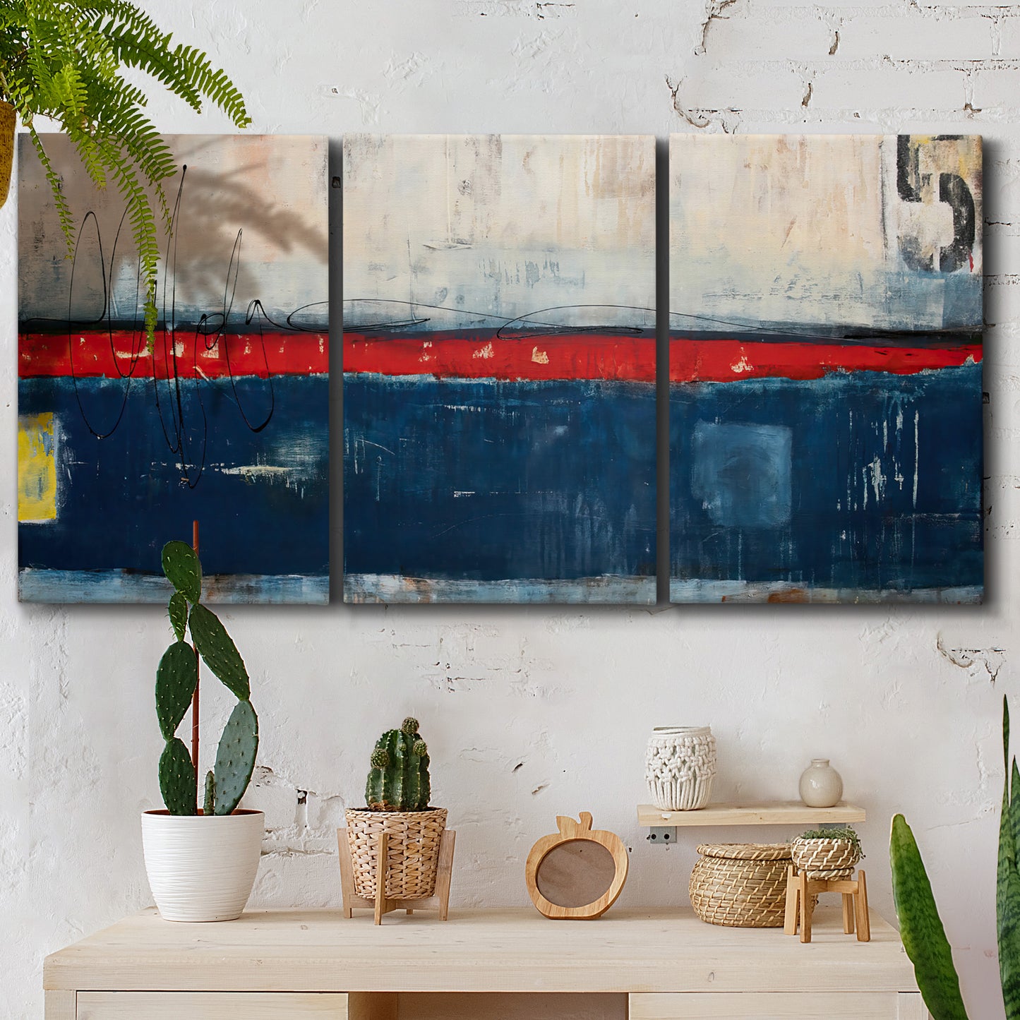 Three-panel canvas wall art featuring weathered coastal dock scene, displayed in a boho-chic entryway above a console table.