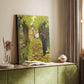 Canvas art print of a figure standing in nature with painting tools nearby styled in a home decor setting.