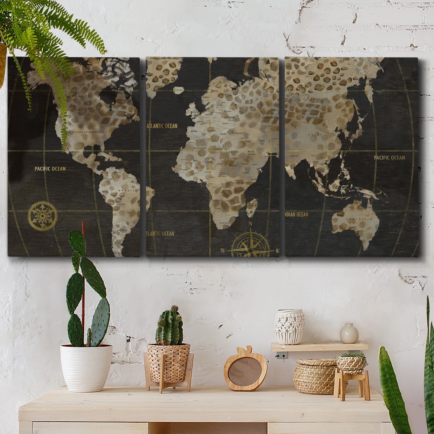 Three-panel canvas wall art featuring illustrated safari world map, displayed in a boho-chic entryway above a console table.